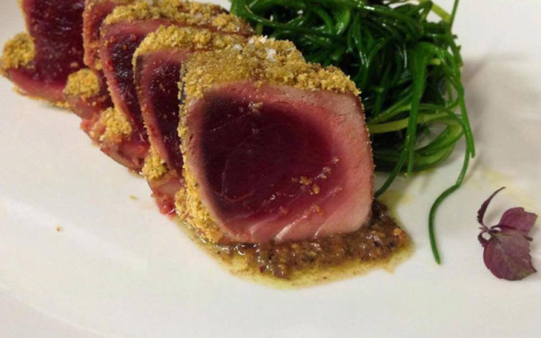 Tuna in a crust of Bronte pistachios on a bed of eggplant purée flavored with mint